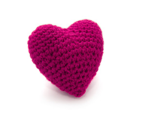 Knitted pink heart isolated on a white background