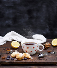 white ceramic mug with black hot tea