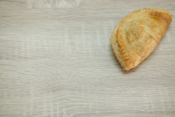 PASTRY ON WOOD TABLE
Puff pastry on wood table.