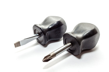 Stubby or small flat head screwdriver and cross head screwdriver, standard screwdriver and philips...