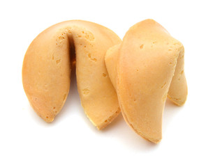Many Chinese fortune cookies stacked up, on white background