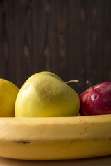red apple on wooden table