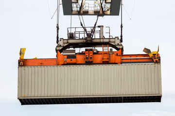 Sea container lifted by a harbor crane