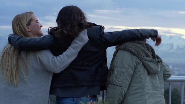 Group Of Best Friends Watch Sunset In Winter At An Overlook In City, They Put Their Arms Around Each Other - Shot On Red Scarlet-W Dragon In 4K/ Slow Motion