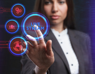 The concept of business, technology, the Internet and the network. A young entrepreneur working on a virtual screen of the future and sees the inscription: Live stream