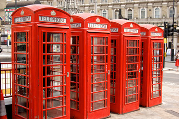 Four famous english red phone booth in the row
