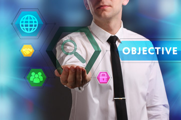 Business, Technology, Internet and network concept. Young businessman working on a virtual screen of the future and sees the inscription: Objective