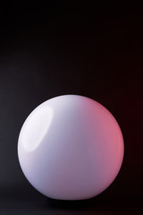 one white spherical lamp isolated on black