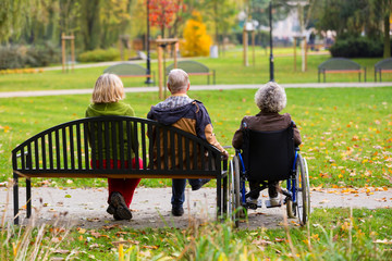 family in the park sitting on a bench