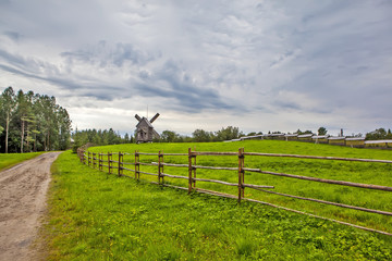Fototapeta premium Windmills. The State Museum of Wooden Architecture and Folk Art of the Northern Regions of Russia 