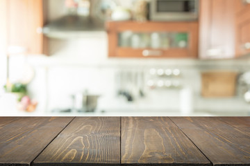 Blurred background. Modern kitchen with tabletop and space for you.