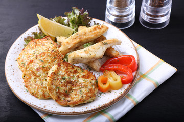 Fried fish with zuccini pancakes