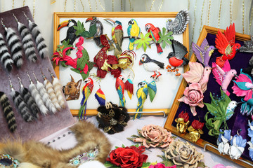 Colorful handmade ornaments, birds and flowers.