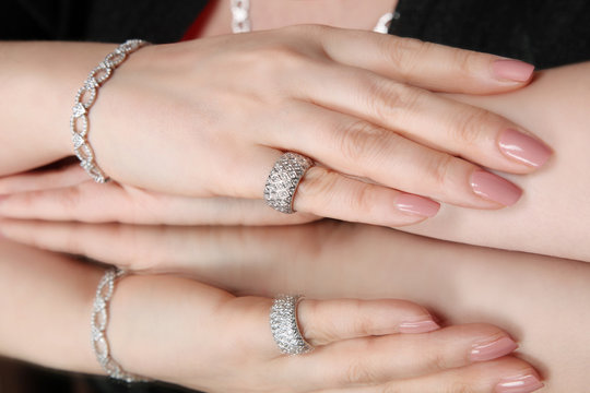 Elegant jewelry set with diamonds, dressed in the hand
