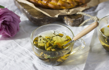 Flower herbal green tea on dinning table with homemade cake