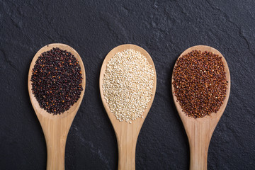 Black , white and red quinoa in spoon