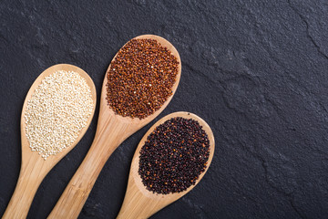 Black , white and red quinoa in spoon