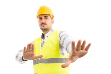 Engineer or foreman acting scared defending gesture.