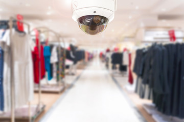 CCTV Security camera shopping department store on blurry background.
