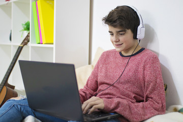 teenager or student working with the computer at home