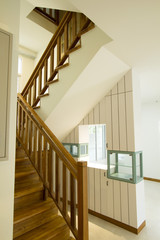 House interior with modern wooden staircase
