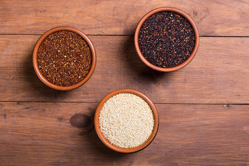 Black , white and red quinoa in spoon