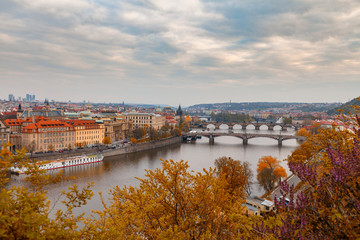 Fototapeta premium Ancient bridges of Prague over Vltava river. Heart of old town. Czech Republic. Golden autumn time.