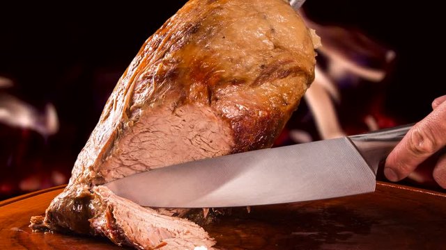 Cupim roasted, traditional Brazilian barbecue with fire background.