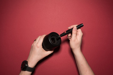 man is cleaning a lense