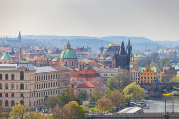 Obraz premium Prague rooftops. Beautiful aerial view of historic center area architecture with red roofs.