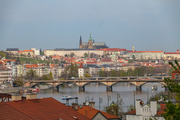 View of Vltava river in Prague and Charles bridge and the Castle, Czech Republic
