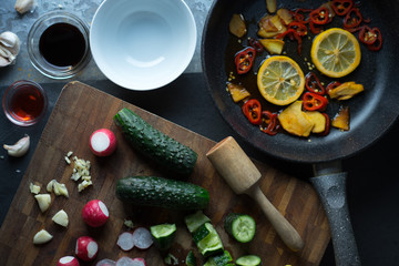 Tableware and vegetables for making sushi top view