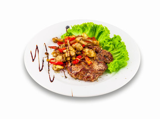 Bacon with green salad, mushrooms and tomatoes on a white plate. Clipping path.