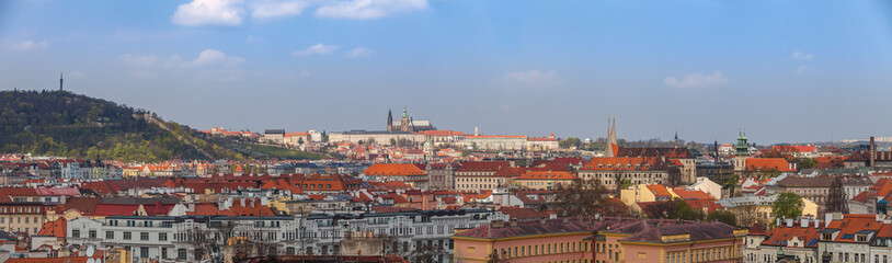 Naklejka na ściany i meble Prague rooftops. Beautiful aerial wide panoramic view of Czech baroque architecture, churches and cathedral.