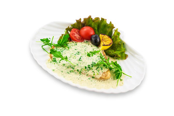Fototapeta na wymiar Pancake stuffed with white sauce, decorated with green leaves on a white plate. Clipping path.