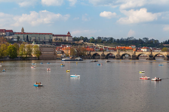 View on the river Vltava with boats. Old town of Prague, Czech Republic, summer season.