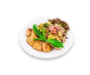 Fried meat with potato salad, greens seasoning white sauce, on a white plate. Clipping path.