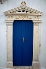 Fototapeta na wymiar Marble decoration on a house's entrance at Pyrgos village, Tinos island, Cyclades, Greece.
