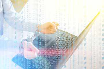 Hackers programmer look on screen and writes the program code hack information and user account