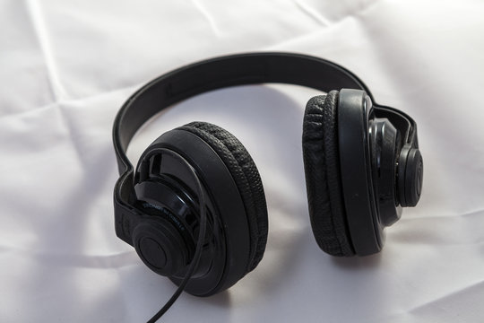 Black classic headphones on white background
