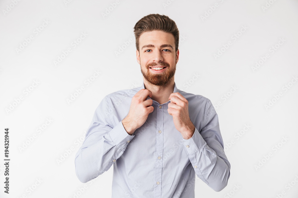 Wall mural Portrait of a charming young man dressed in shirt