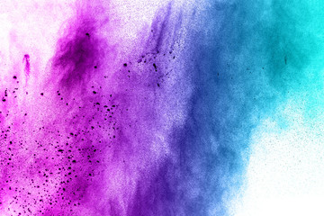 abstract explosion of blue purple dust on white background.Abstract blue purple powder splatter on white  background. Freeze motion of blue purple powder splash.