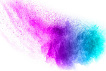 abstract explosion of blue purple dust on white background.Abstract blue purple powder splatter on...