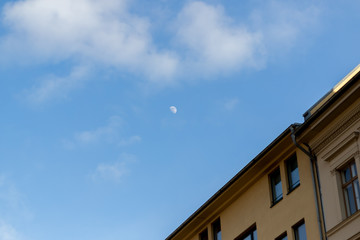 Fototapeta na wymiar moon blue sky city day