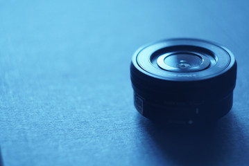 black lens on a blue background, focus