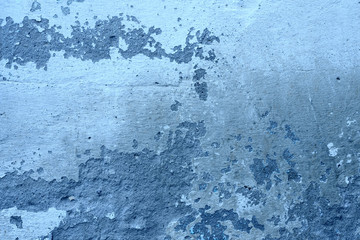 Wall fragment with scratches and cracks