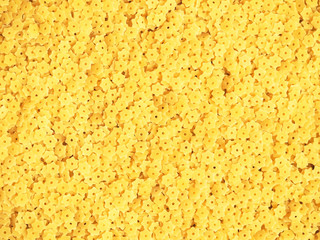 Macaroni stars background. Star shaped noodles texture. Italian pasta for soup. Star shaped noodles texture, stelline