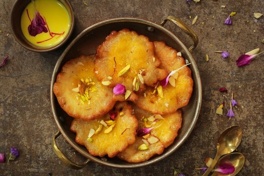 Malpua - Traditional Indian sweet pancake coated in sugar syrup