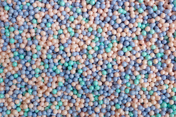 Sugar candy for decorating a cake. Confectionery decoration close-up. Shades of pearls. Abstract background.