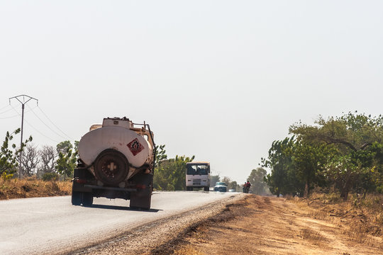 Fuel truck and traffic on the State Road 1 heading to Bobo-Dioulasso, Burkina Faso.
